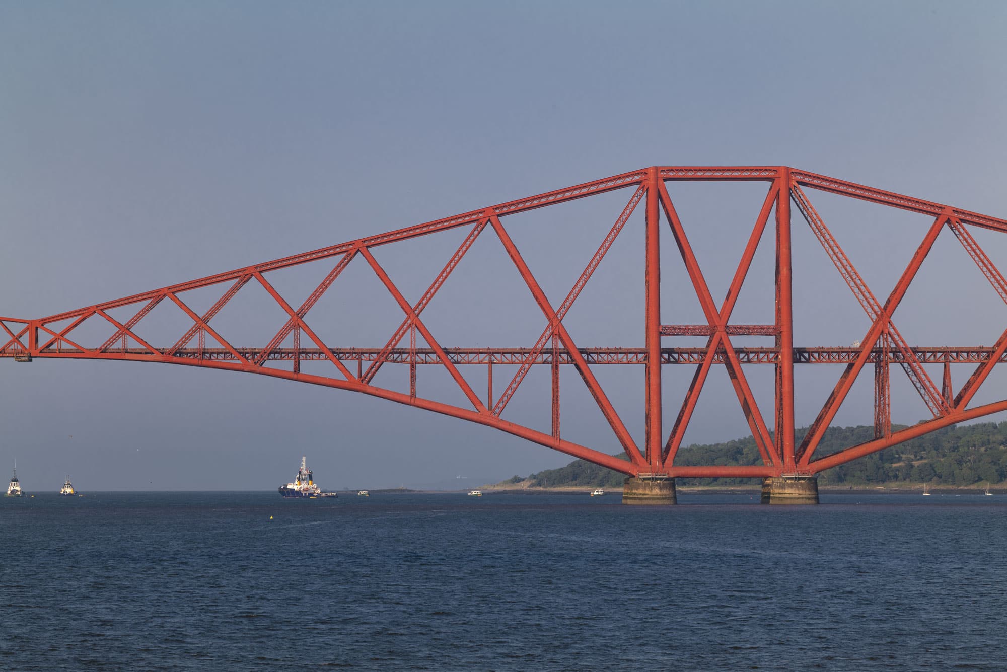 The red Forth Rail Bridge in soft evening light in July